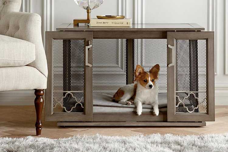 Living room side table setup to be a dog crate that looks like part of the furniture.